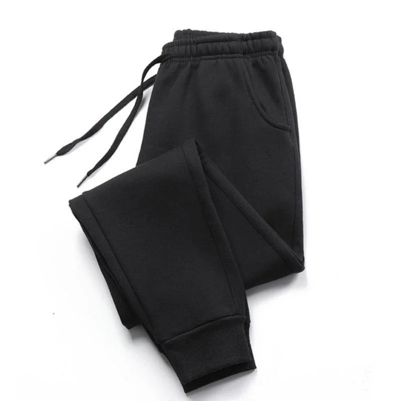 Men’s Casual Sports Jogger Sweatpants Gym Pants in black color, featuring an elastic waistband and pockets.