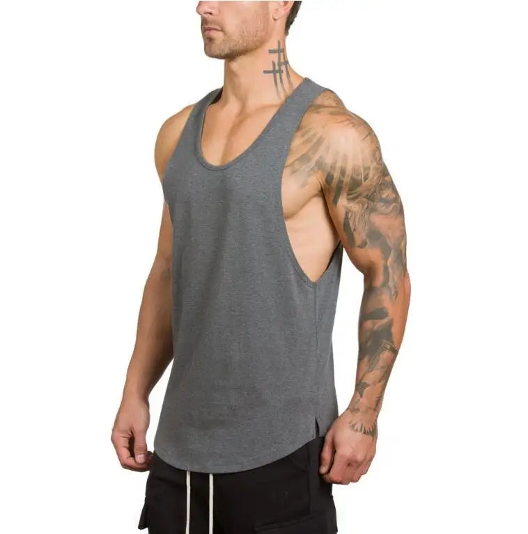 Men’s Gym Vest Bodybuilding Tank Top Fitness Stringer Workout Wear worn by a muscular man in gray.