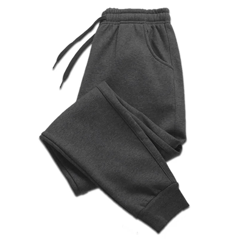 Men’s Casual Sports Jogger Sweatpants Gym Pants in dark gray color with elastic waistband and pockets.