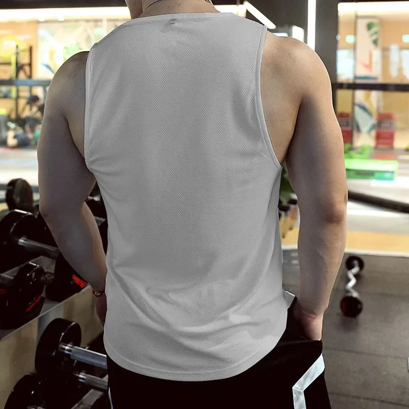Men’s Gym Tank Top Quick-Dry Fitness Running Vest Bodybuilding Shirt worn by a man showing the back view in a gym setting.