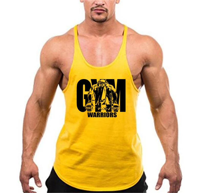 Men’s Gym Tank Top Cotton Y-Back Fitness Muscle Bodybuilding Vest in yellow worn by a muscular man.