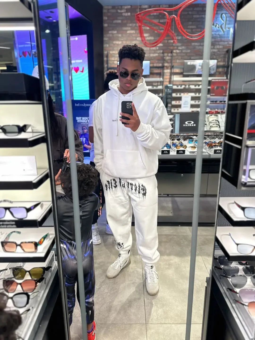 2024 Men’s Sports Pants Casual Gym Training Joggers for New Year worn by a person in a store reflecting modern style and comfort.