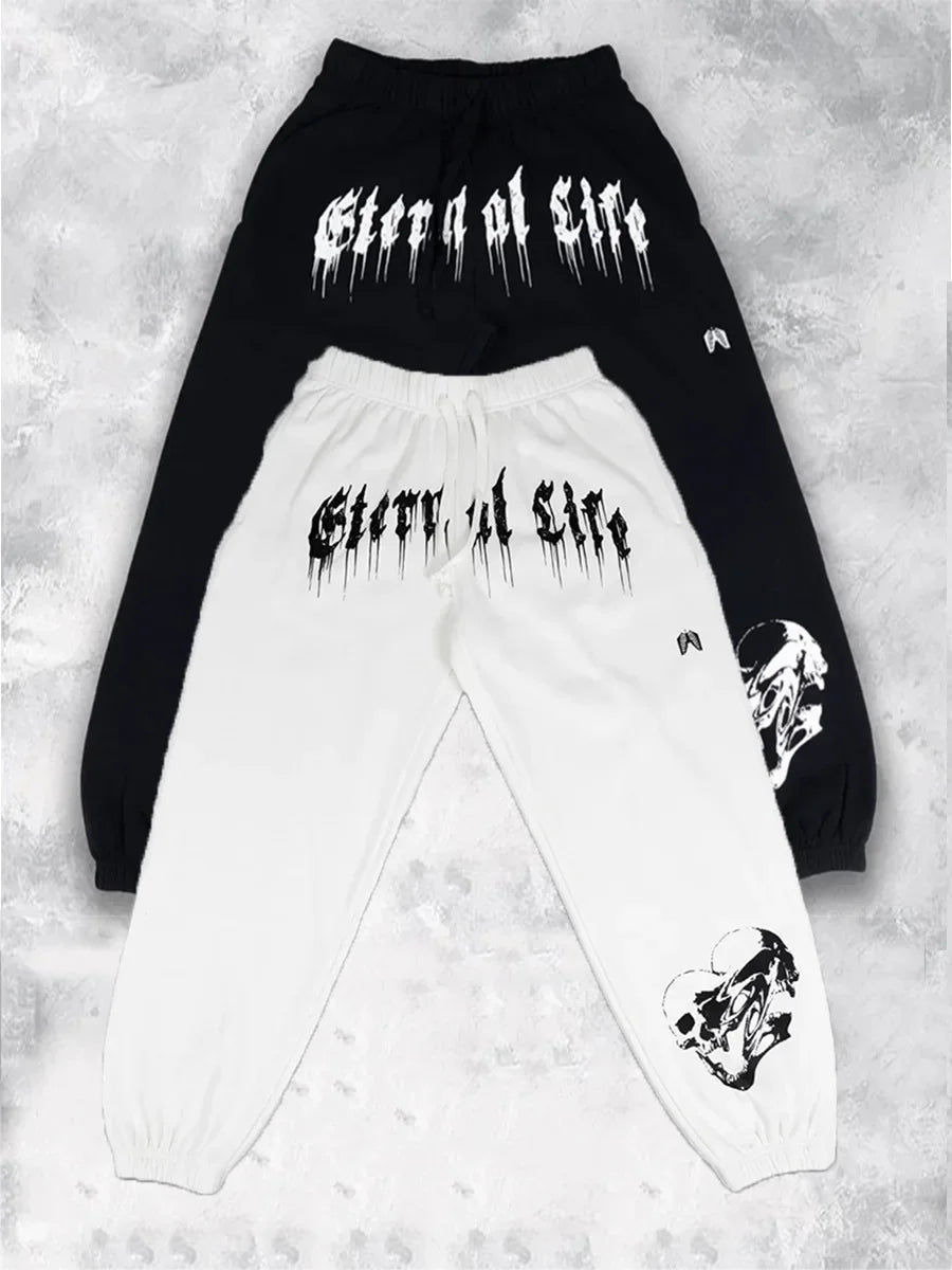 2024 Men’s Sports Pants Casual Gym Training Joggers for New Year in black and white with graphic designs.
