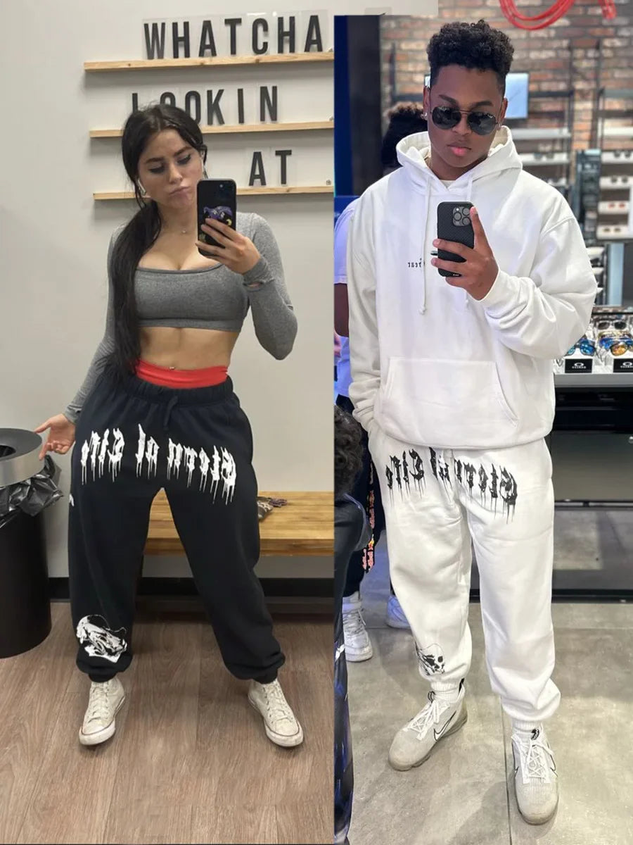 2024 Men’s Sports Pants Casual Gym Training Joggers for New Year worn by individuals in casual athletic settings.